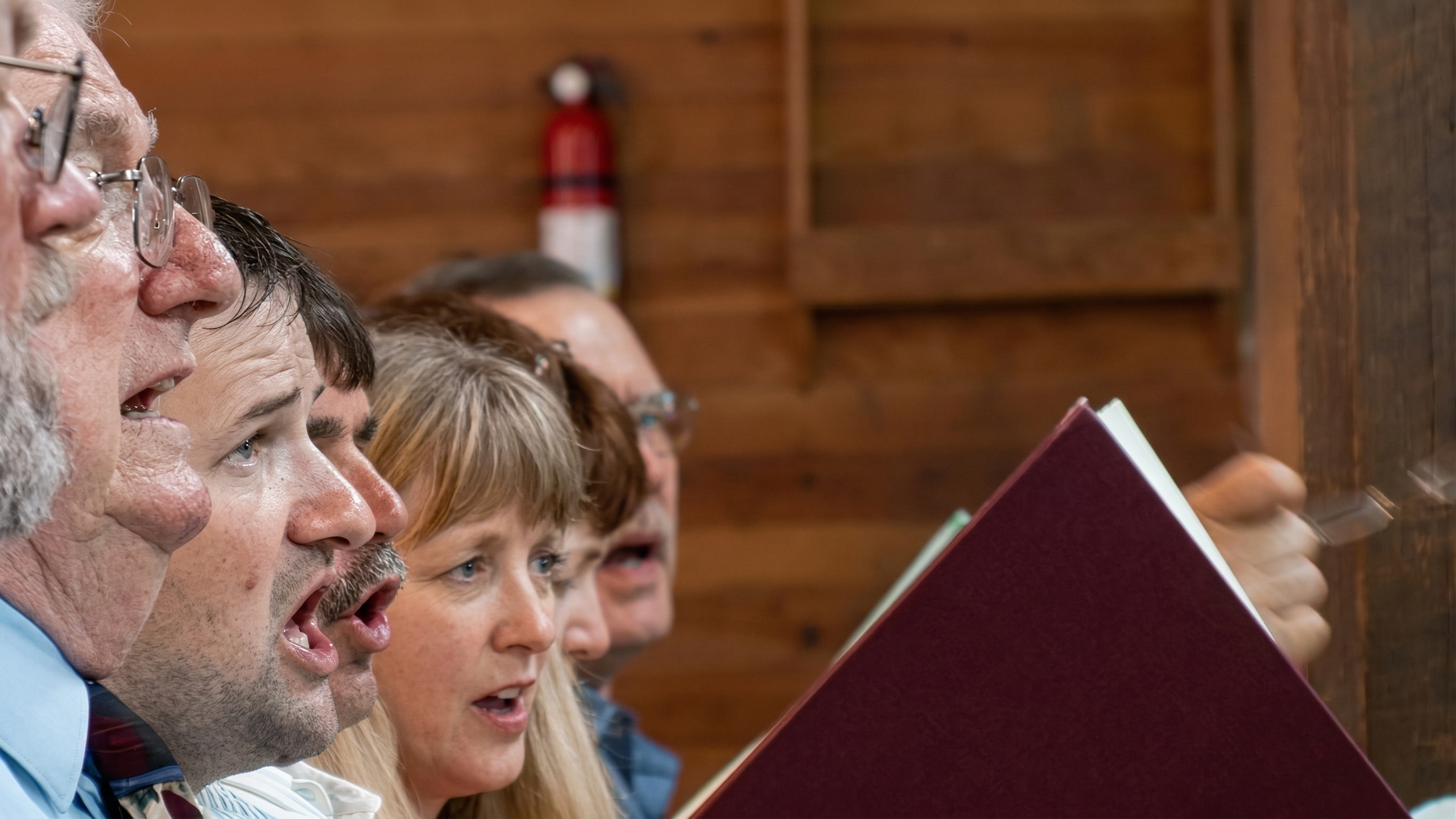 front-bench-of-tenor-section-at-holly-springs-sacred-harp-convention-still-from-awake-my-soul.png